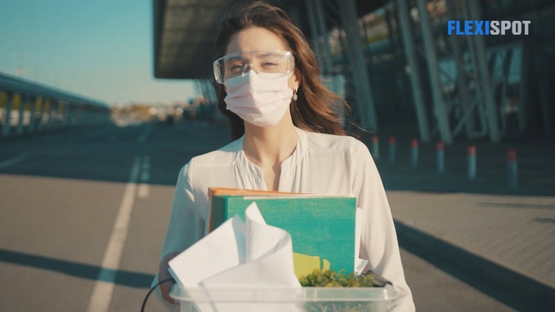 masked woman leaving office