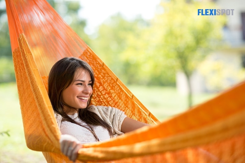Smiling girl resting in hammock