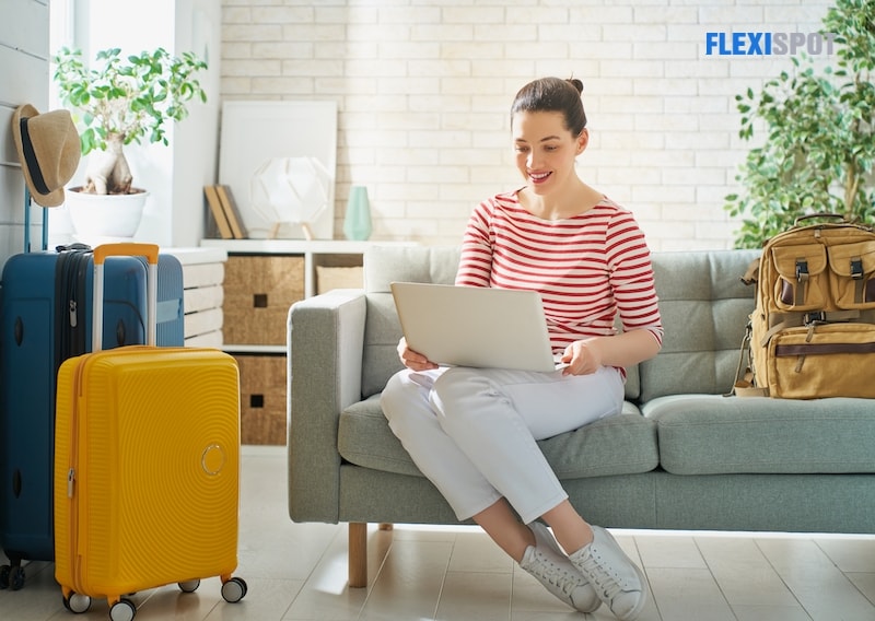 Woman with tablet computer booking tickets online at home