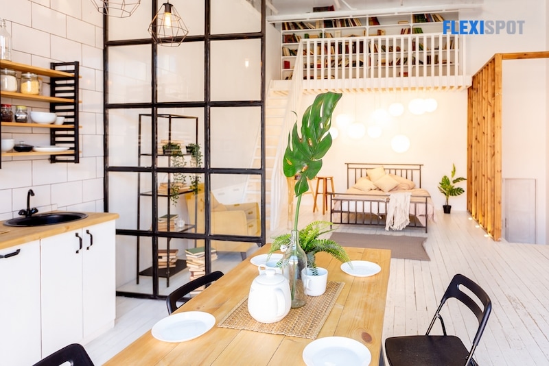 Set wooden table in modern dining room. Modern bright flat apartment in the attic